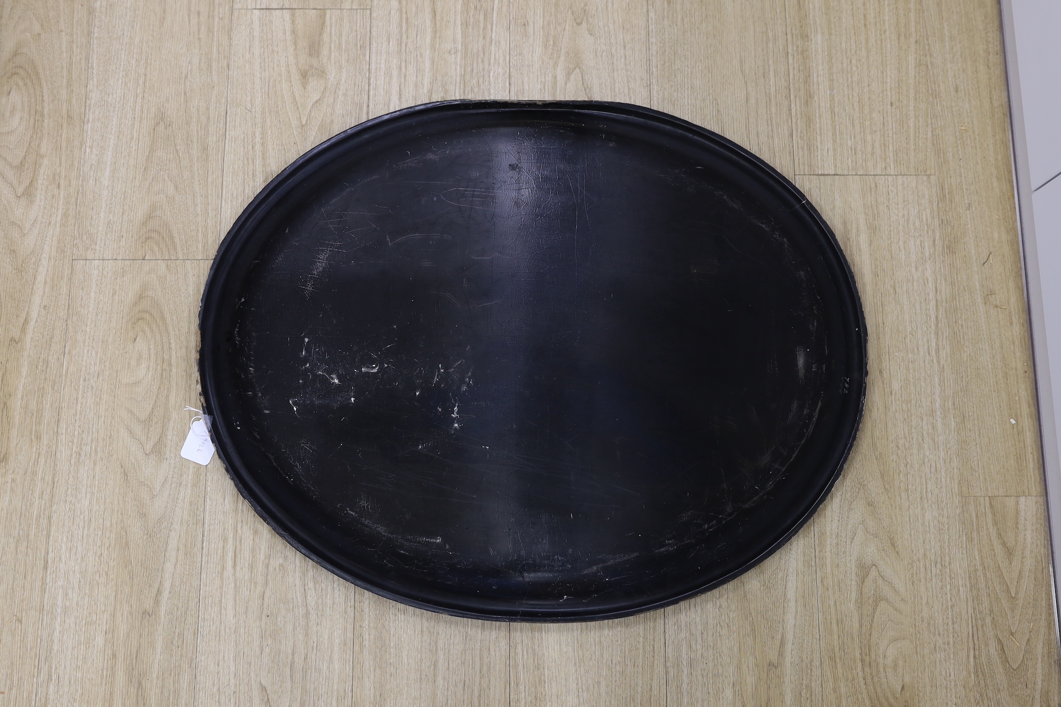 A large Regency oval japanned papier mache tray, 81cm long